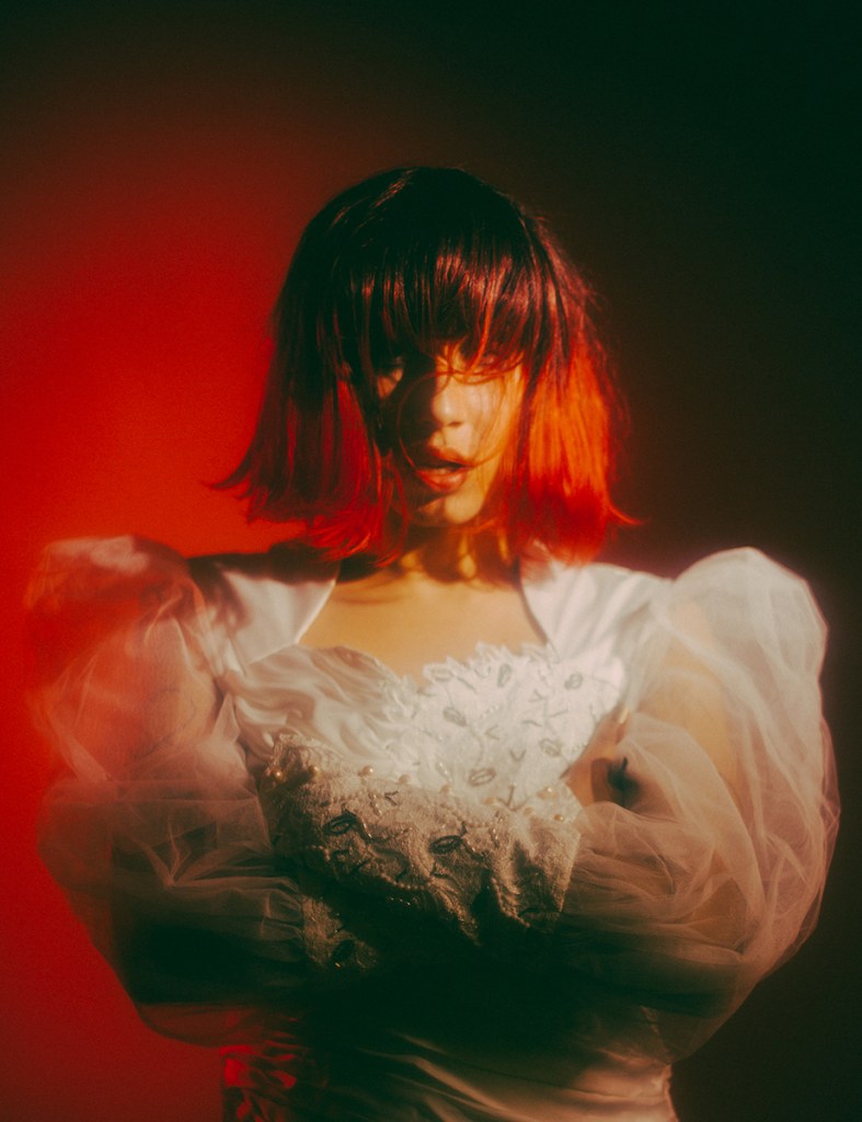Red haired girl in a grunge white dress 
